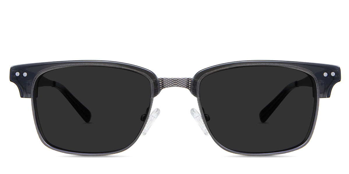 Brad black tinted Standard Solid sunglasses in the Manouria variant - is a full-rimmed medium-sized frame with diamond emboss in the bridge, a broad metal arm, and regular thick acetate tips.