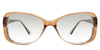 Lois Black tinted Gradient in the ocher variant - is a two-toned oval frame with a slim temple arm.