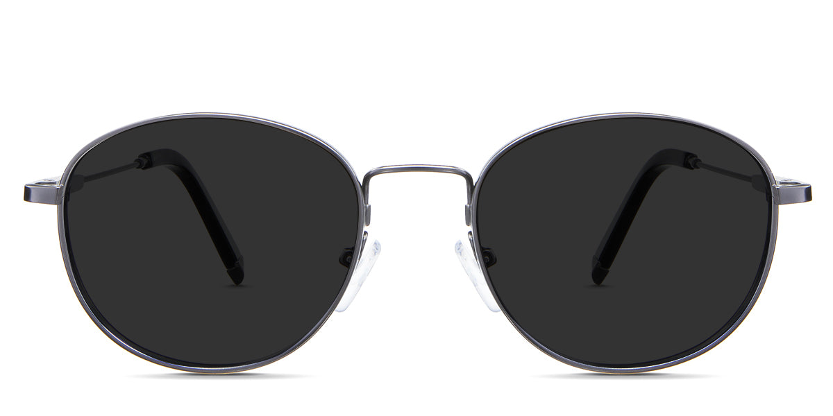 Noa Gray Polarized  in the Gun variant - combines a round, oval-shaped frame with a  wide adjustable nose bridge and large symmetric temple tips.