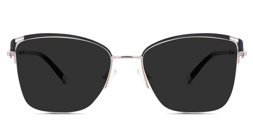 Phoebe Gray Polarized  in the Vulture variant - it's a cat-eye shape frame with a narrow nose bridge and a combination of metal and acetate temple arms.
