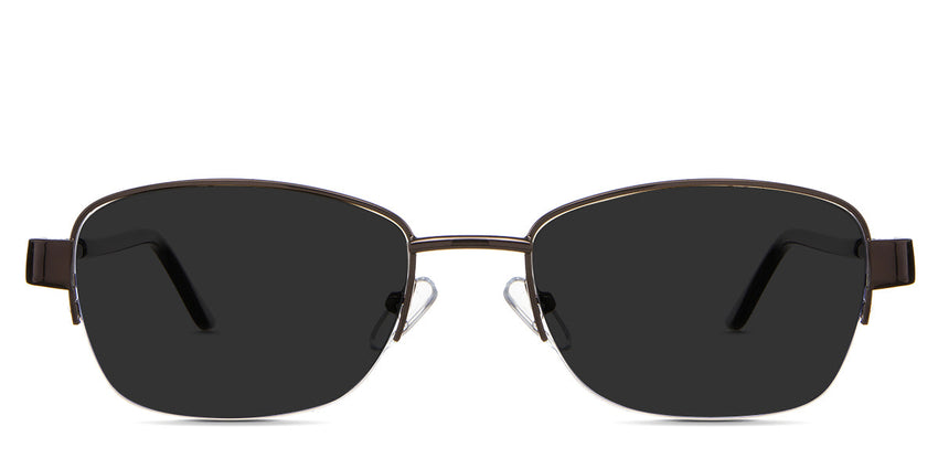 Sadie Gray Polarized in the Truffle variant - is a rectangular frame with a low-sized nose bridge and has a decorative metal connecting the rim and arm.