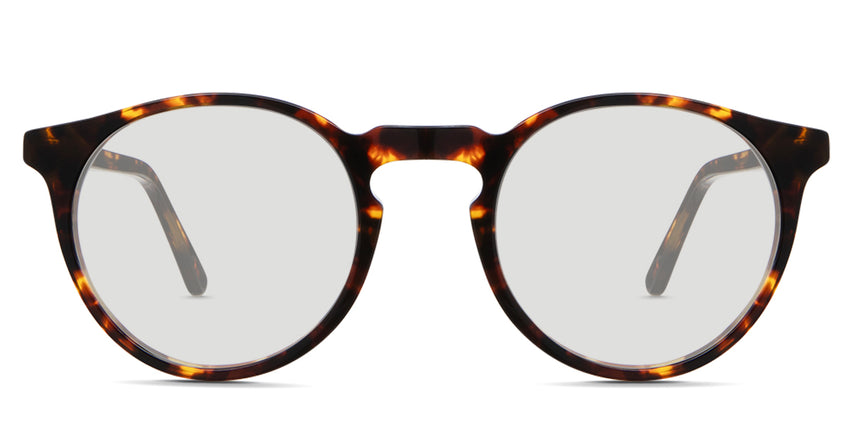 Seraph black tinted Standard Solid sunglasses in Delaney variant - it's a rounded acetate frame in tortoise pattern and have a high keyhole nose bridge.