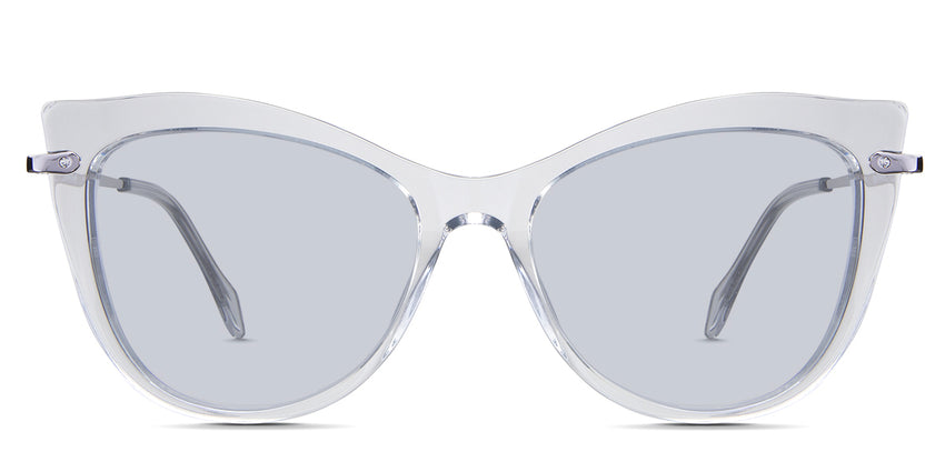 Susan Blue Tinted Solid in the Crystal variant - is a cat-eye frame with a U-shaped nose bridge and a combination of metal arm and acetate tips.