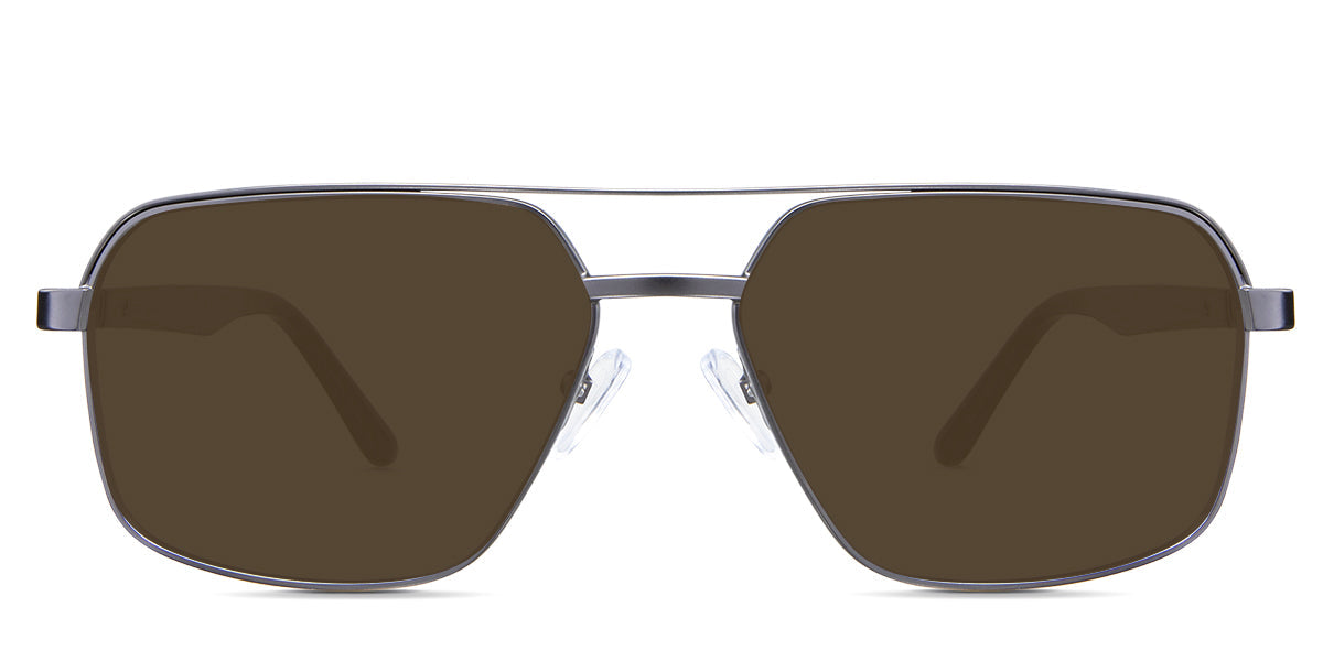 Xavier Brown Polarized in the Gun variant - it's an aviator-shaped frame with silicone nose pads and paddle-shaped temple tips.
