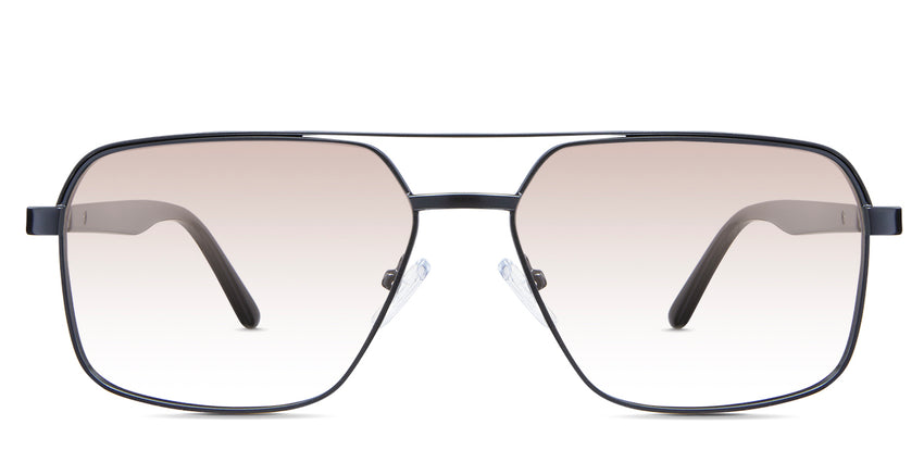 Xavier Rose Tinted Gradient in the Ursus variant - it's a rectangular frame with a two-bar metal bridge and a whole acetate temple.