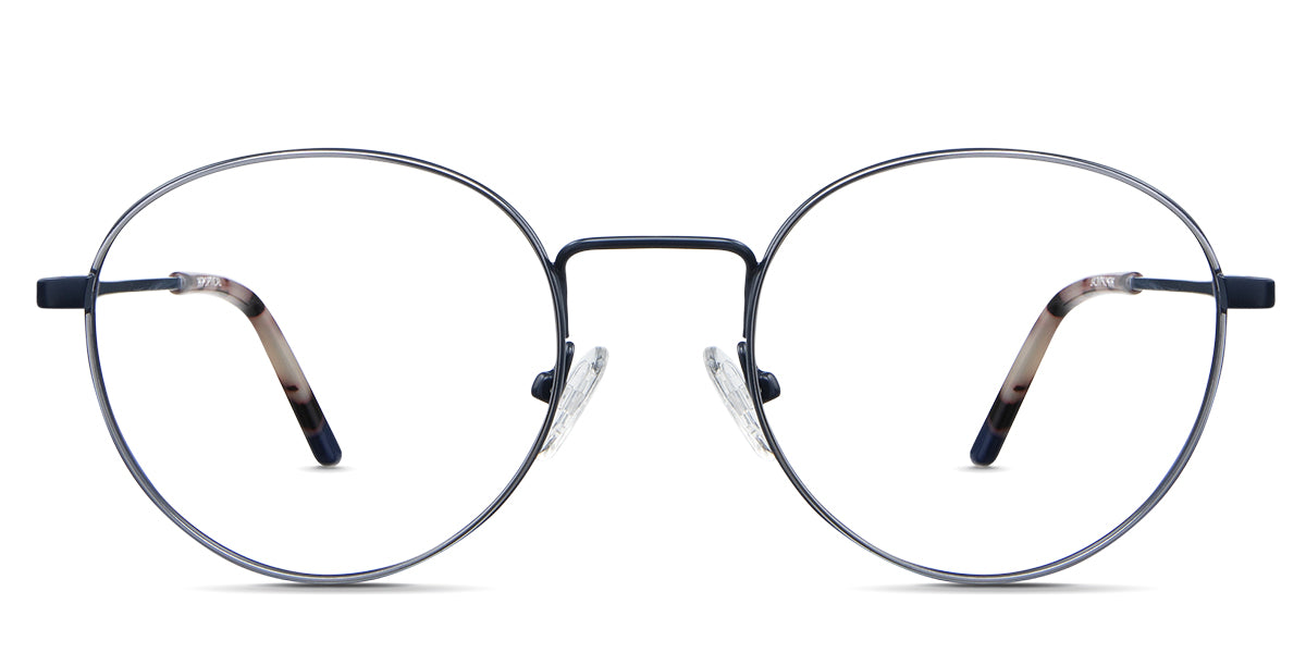 Adler Eyeglasses in the capri variant - it's a round frame with silver and navy color. Latest Metal