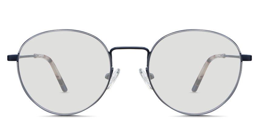 Adler Black Tinted Standard Solid in the Capri variant - it's a round frame with a high nose bridge and a slim metal arm and acetate tips.