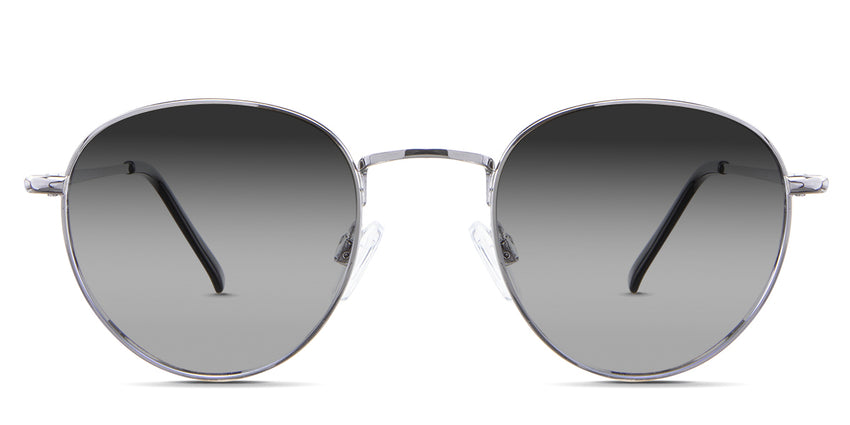 Allison black tinted Gradient sunglasses in the Shrike variant - they're narrow-sized metal frames with a high nose bridge.