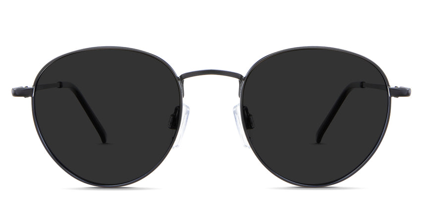 Allison black tinted Standard Solid sunglasses in the Sumi variant - is a round frame with adjustable nose pads and a slim temple arm.