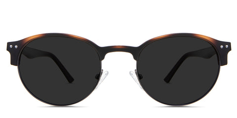 Andi black tinted Standard Solid in the Tortoise variant—it's a club master shape frame with silicon adjustable nose pads and an acetate temple.