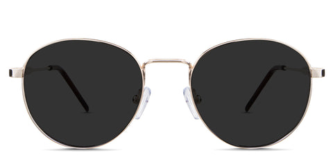 Axel black tinted Standard Solid in the Gold variant - is a metal frame with a high nose bridge and a combination of metal arm and acetate tips.