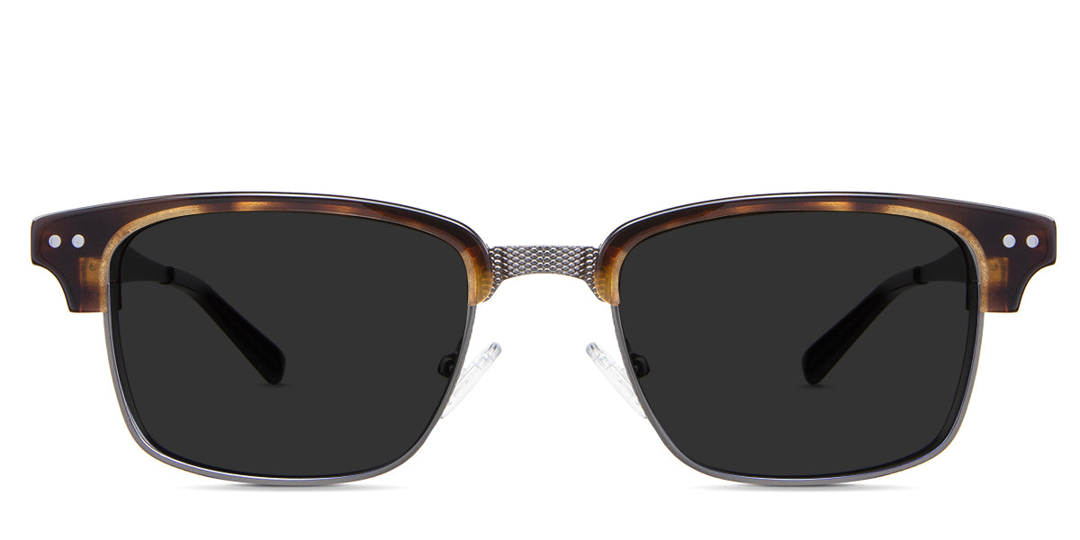 Brad black tinted Standard Solid sunglasses in the Manouria variant - is a full-rimmed medium-sized frame with diamond emboss in the bridge, a broad metal arm, and regular thick acetate tips.