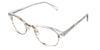 Brice eyeglasses in the moissanite variant - have a gold metal full-rimmed frame and a crystal acetate half-rimmed frame.