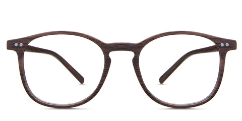 Coven Eyeglasses in the sealywood variant - it's a round frame with a brown woody color pattern.