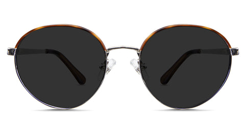 Coyle Black Sunglasses Standard Solid in the Earthen variant - it's a round frame with a flat, wide nose bridge and a regular broad temple arm.