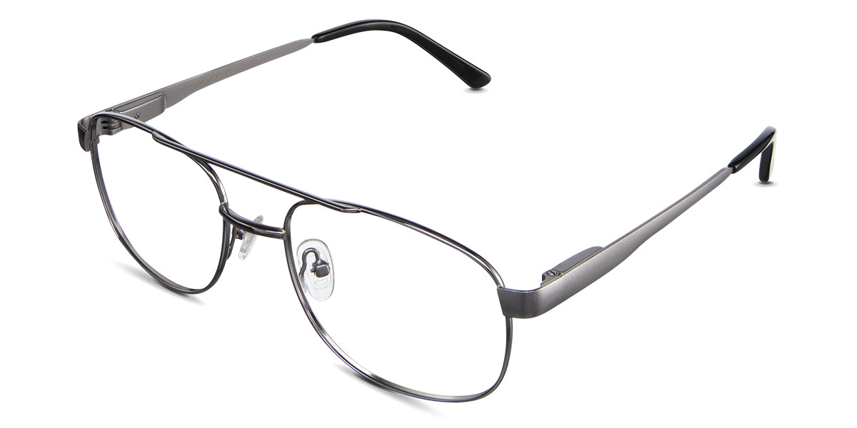 Dixon Eyeglasses in the ebony variant - have a thin metal rim with an extended end piece.