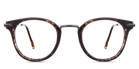 Eden eyeglasses in the roastery variant - it's a round frame in tortoise and gun color.