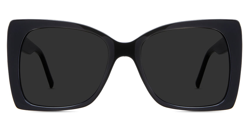 Ella black tinted Standard Solid sunglasses in the Licorice variant - is an acetate frame with an 18mm width nose bridge and a decorative metal connecting the hinge to the arm.