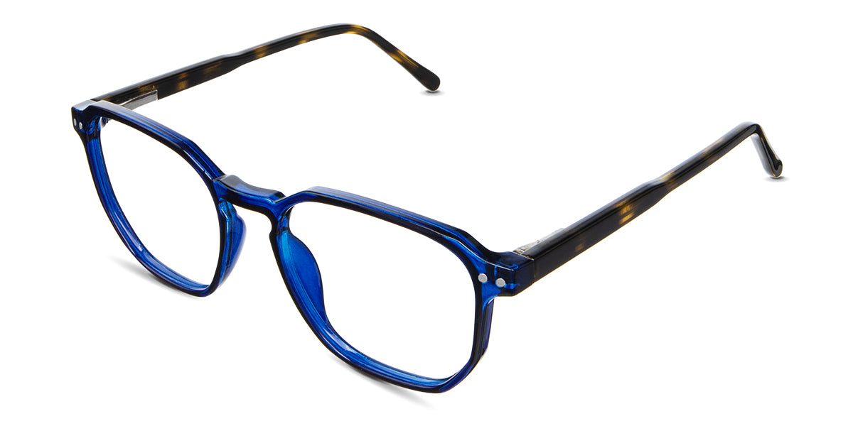 Finn Eyeglasses in the campanula variant - have a navy blue rim and a tortoise color arm.