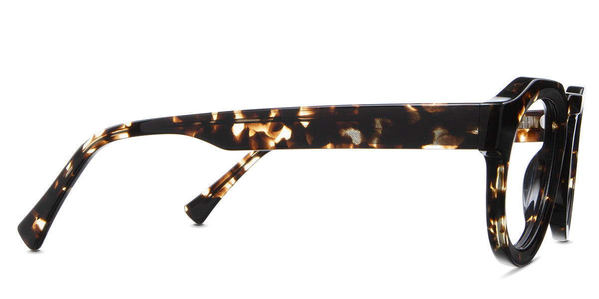 Jax Eyeglasses in bison variant - have a long temple arm with a hockey shape tip.
