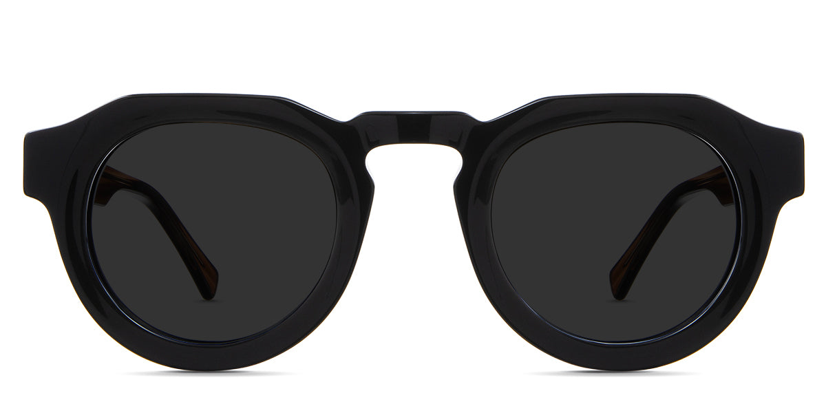 Jax black tinted Standard Solid sunglasses in carob variant - is a narrow, thick acetate frame with 24mm nose bridge and transparent temple arms with visible wire core.