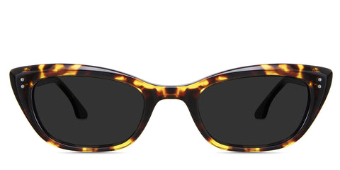 Judy black tinted Standard Solid in the Tortoise variant - it's a full-rimmed acetate frame with a wide nose bridge and a regular thick temple arm
