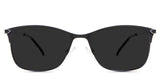 Kira black tinted Standard Solid sunglasses in the beluga variant - it's a metal frame with a narrow U-shaped nose bridge and a unique design connecting the endpiece to the temple arm.