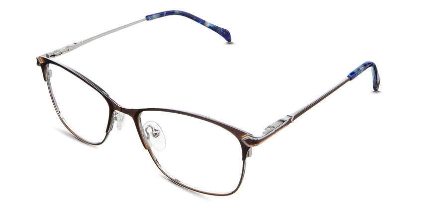 Kira Eyeglasses in the okapi variant - have a brown color on the outer and a silver color on the inner side.