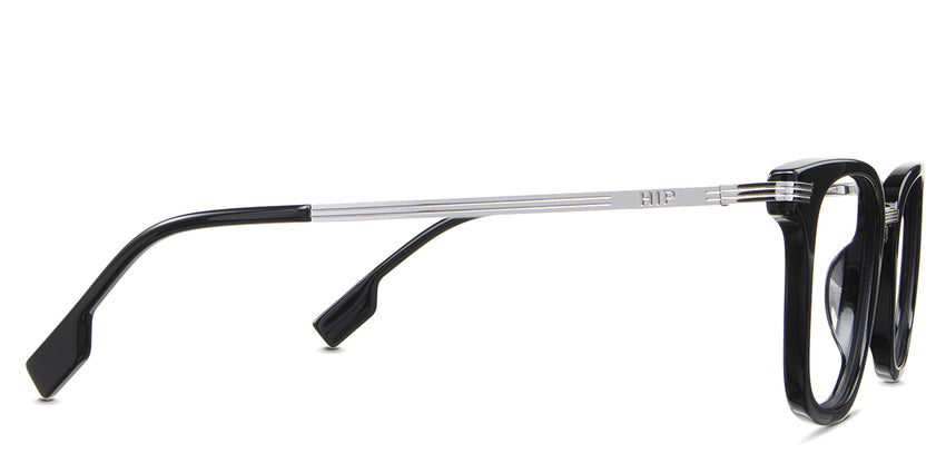 Koa Eyeglasses in the linux variant - have a silver metal arm with a stripes carving pattern.