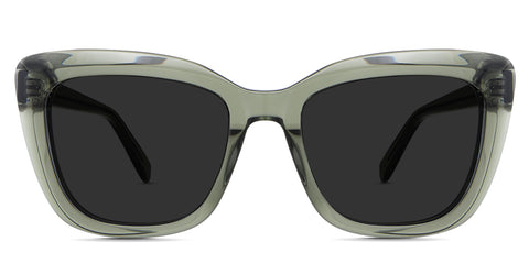 Lesa black tinted Standard Solid Sunglasses in the Midori variant - it's a transparent medium-thick frame in a cat eye shape with a built-in nose bridge.