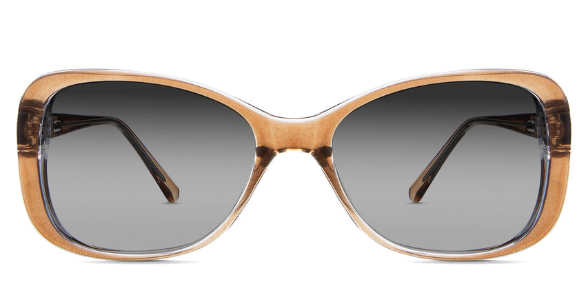 Lois black tinted Gradient in the Ocher variant - is a two-toned oval frame with a slim temple arm.