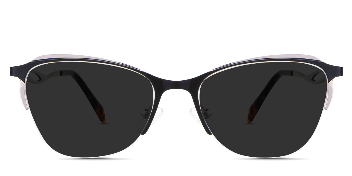 Lux Gray Polarized in the Melanites variant - it's a cat-eye-shaped frame with a U-shaped nose bridge and has a combination of metal and acetate temples.