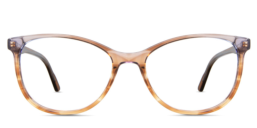Maggie eyeglasses in the tut variant - it's an oval shape frame in transparent brown color.