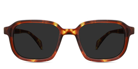 Niro Black Sunglasses Solid in the Cinnamon variant - it's a rectangular thin frame in tortoise color with a patterned wire core visible in the arm.