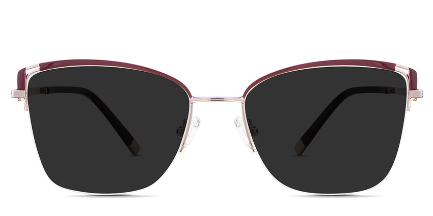 Phoebe black tinted Standard Solid sunglasses in the Carmine variant - is a metal frame with adjustable nose pads, a thin temple arm, and wide tips.