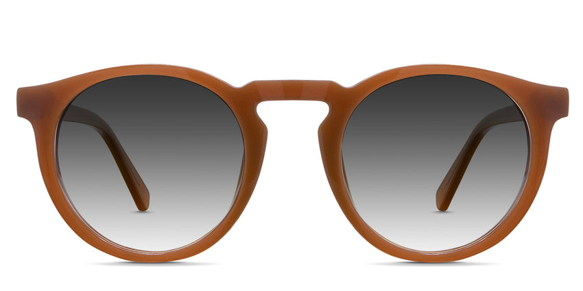 Rino black tinted Gradient sunglasses in the saffron variant - is a full-rimmed round shape frame with a keyhole nose bridge and a visible wire core.