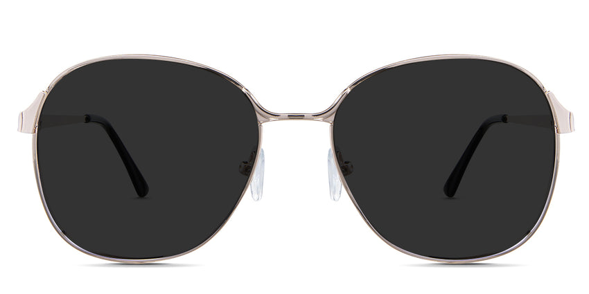 Sara black tinted Standard Solid sunglasses in the Buff variant - is a metal frame with silicon adjustable nose pads and has a combination of metal and acetate temples.
