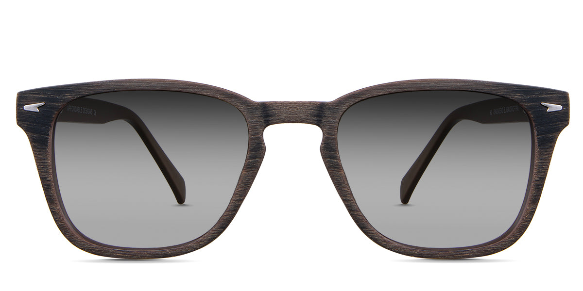 Senecio black tinted Gradient sunglasses in the elmwood variant - it's a square full-rimmed frame with a wooden pattern and a metal emboss in the end piece.