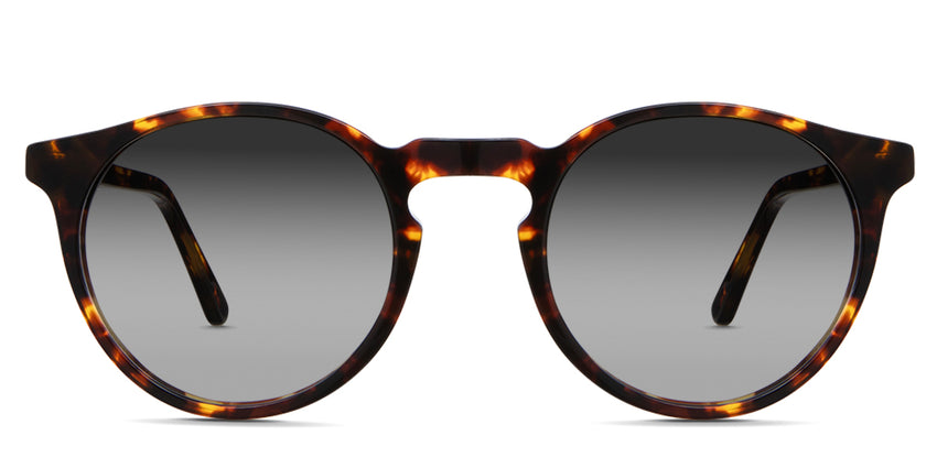 Seraph black tinted Gradient sunglasses in Delaney variant - it's a rounded acetate frame in tortoise pattern and have a high keyhole nose bridge.