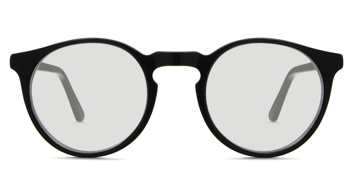 Seraph black tinted Standard Solid sunglasses in Delaney variant - it's a rounded acetate frame in tortoise pattern and have a high keyhole nose bridge.