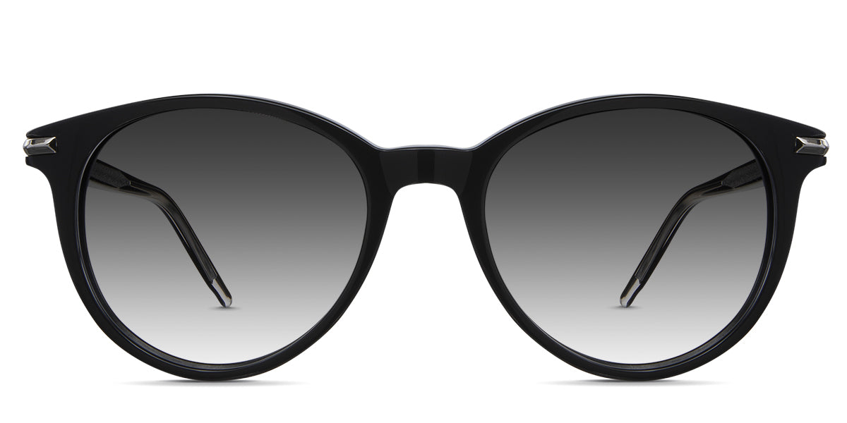 Sile black tinted Gradient sunglasses in cattle variant - it's a round frame with a slightly cat-eye look with a brushed metal style on the inside of the arm.