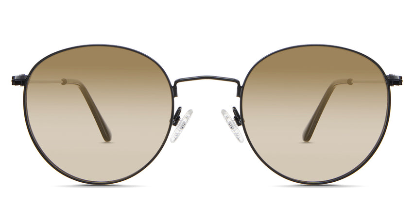 Sol Beige Sunglasses Gradient in the Sumi variant - it's a thin round frame with silicon adjustable nose pads and frame information written inside the temple tips front