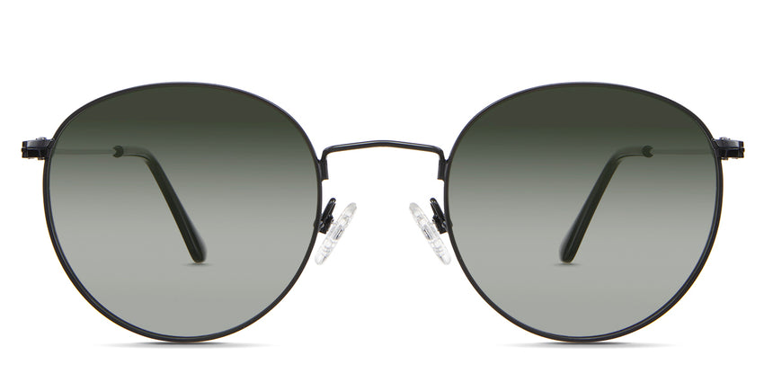 Sol Green Sunglasses Gradient in the Sumi variant - it's a thin round frame with silicon adjustable nose pads and frame information written inside the temple tips front