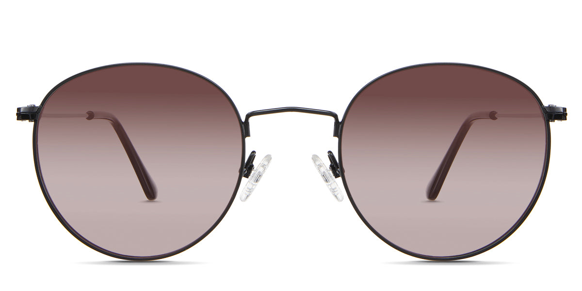 Sol Rose Sunglasses Gradient in the Sumi variant - it's a thin round frame with silicon adjustable nose pads and frame information written inside the temple tips front