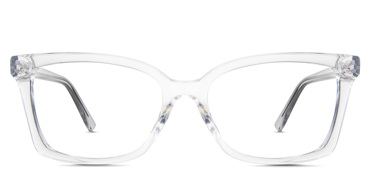 Stella eyeglasses in the crystal variant - it's an acetate frame with three round rivets embossed at the end piece.