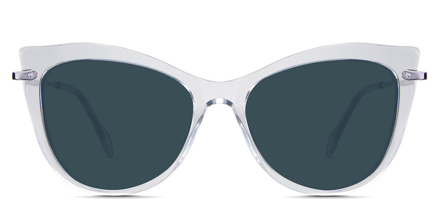 Susan Blue Sunglasses Solid in the Crystal variant - is a cat-eye frame with a U-shaped nose bridge and a combination of metal arm and acetate tips.