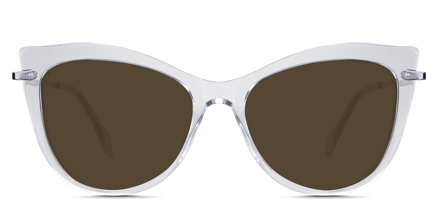 Susan Brown Sunglasses Solid in the Crystal variant - is a cat-eye frame with a U-shaped nose bridge and a combination of metal arm and acetate tips.