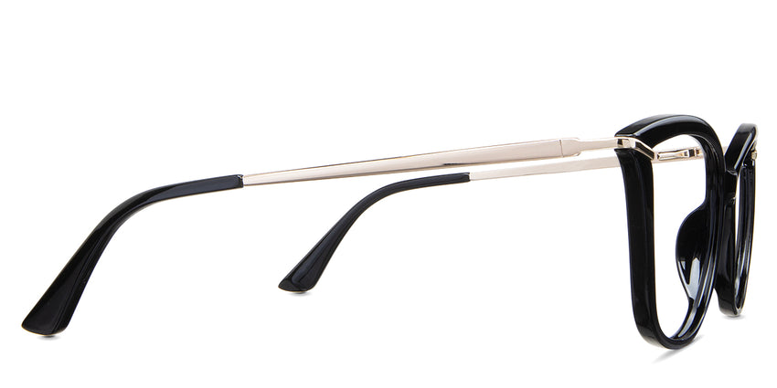 Yuki eyeglasses in the lasius variant - have a gold metal arm and black acetate tips.