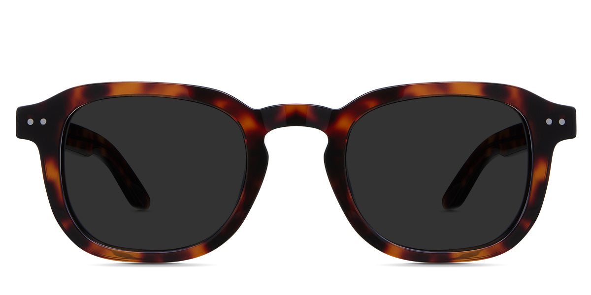 Zuri black tinted Standard Solid sunglasses in caretta variant - is a full rimmed frame with keyhole shaped nose bridge and acetate temple arms. 