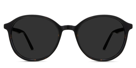 Anso black tinted Standard Solid sunglasses in spiny variant - it's a round acetate frame with a thin rim and temple arm.